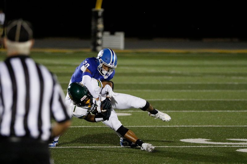 Oshkosh West's Elijah Wilder tackles a Green Bay Preble player on Friday, Aug. 22, 2025.