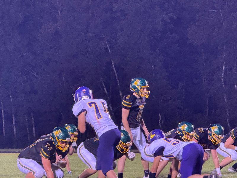 Edgar quarterback #11 Tucker Streit walks to the line to prepare for a play at Edgar High School on Aug. 21, 2025.