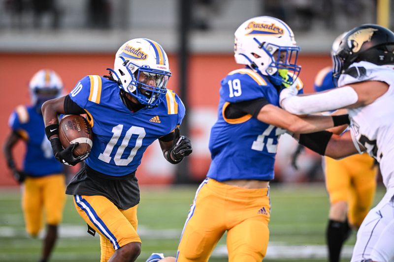Catholic Memorial wide receiver Zy’aire Smith (10) picks up a block from wide receiver Ethan Adamson (19) against Franklin in a game Friday, August 22, 2025, at Schneider Stadium in Waukesha, Wisconsin.