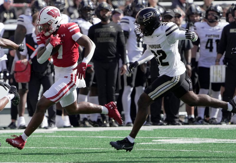 Oct 5, 2024; Madison, Wisconsin, USA; Wisconsin Badgers running back Dilin Jones (7) runs for 47 yards against the Purdue Boilermakers during the fourth quarter at Camp Randall Stadium. Mandatory Credit: Mark Hoffman/USA TODAY Network via Imagn Images