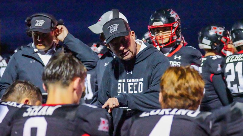Muskego varsity football head coach Ken Krause talks to players during the game against Oak Creek, Aug. 29, 2025 in Muskego, Wisconsin. Muskego won the game, 41-17.