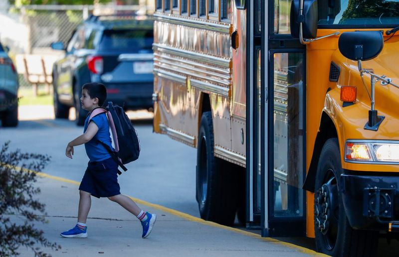 A students gets off the bus for the first day of school on Tuesday, September 2, 2025, at Lincoln Elementary School in Green Bay, Wis. 
Tork Mason/USA TODAY NETWORK-Wisconsin
