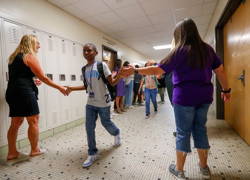 A students is greeted by faculty members for the first day of school on Tuesday, September 2, 2025, at Franklin Middle School in Green Bay, Wis. 
Tork Mason/USA TODAY NETWORK-Wisconsin