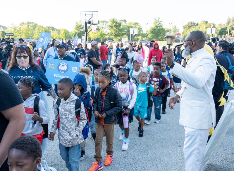 (Right) Principal Raymond Unanka greets students during the first day of school at Browning Elementary School on Tuesday September 2 in Milwaukee, Wisconsin.