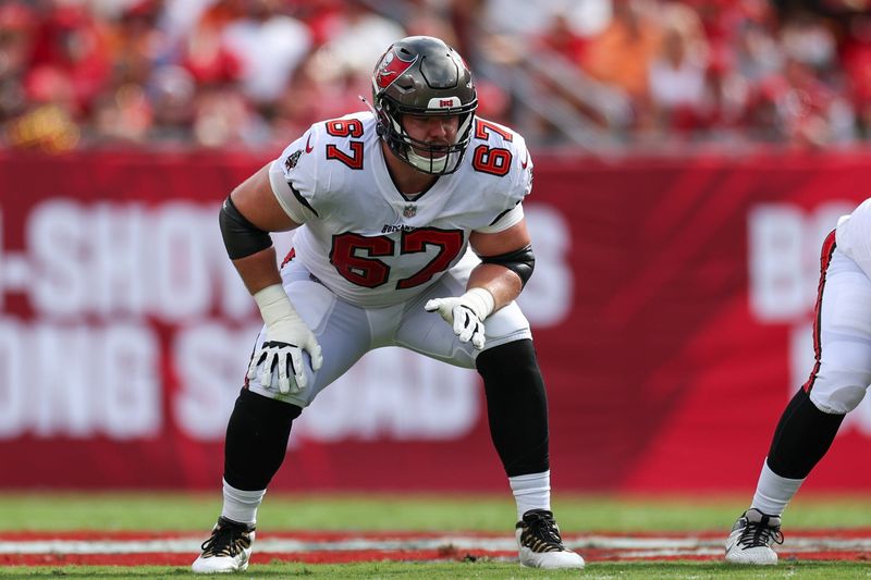 Sep 8, 2024; Tampa, Florida, USA; Tampa Bay Buccaneers offensive tackle Luke Goedeke (67) lines up against the Washington Commanders in the first quarter at Raymond James Stadium.