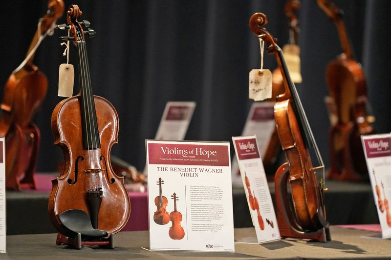 The Benedict Wagner violin, left, is among the 70 instruments on display that Milwaukee Youth Symphony Orchestra has brought to Milwaukee and Wisconsin as part of the Violins of Hope project.