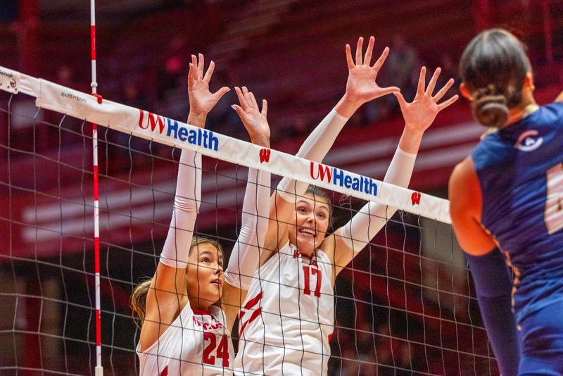 Wisconsin setter Charlie Fuerbringer (24) and middle blocker Alicia Andrews (17) attempt a block in the Badgers' three-set win over UC Davis at the UW Field House in Madison on Sept. 4, 2025.