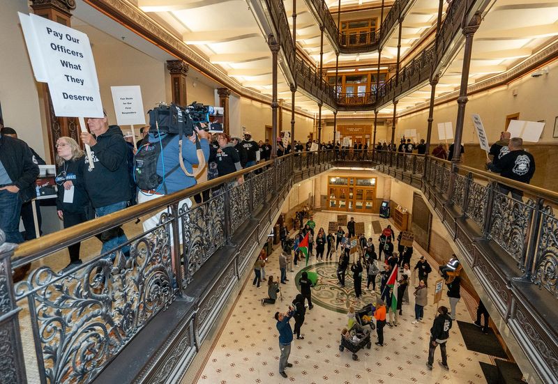 BLOC (Black Leaders Organizing Communities) hold a counter protest on the first floor of City Hall as the Milwaukee Police Association protests for a wage increase outside of Mayor Cavalier Johnson’s office on the second floor on Friday September 5, 2025 in Milwaukee, Wisconsin.