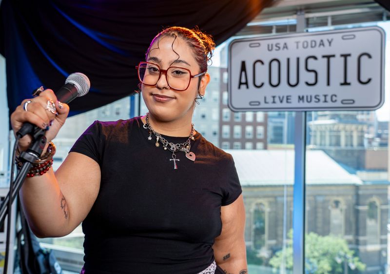 *aya poses for a photo after performing for the USA TODAY Acoustic series in the Milwaukee Journal Sentinel newsroom on July 18, 2025.