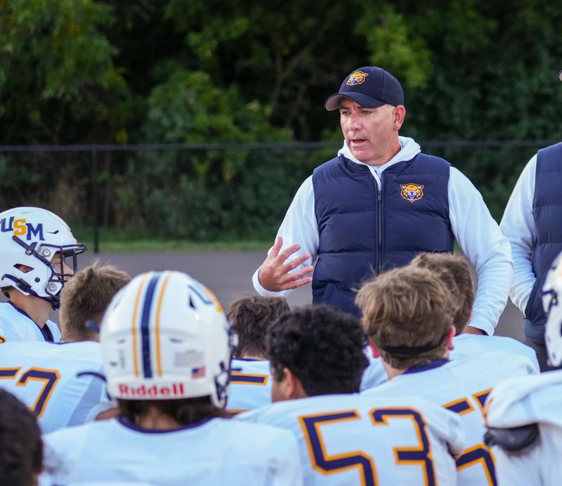 University School of Milwaukee football head coach Brian Sommers talks with players prior to the game against Martin Luther on Friday, Sept. 5, 2025, in Greendale, Wisconsin.