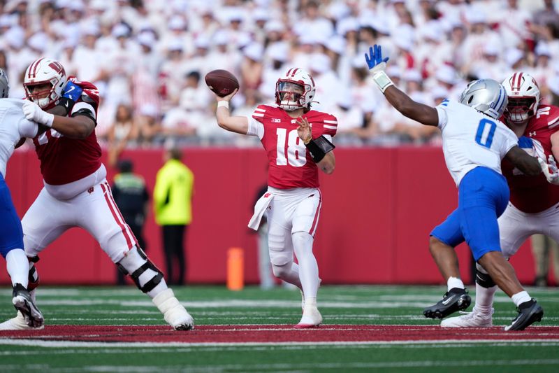 Sep 6, 2025; Madison, Wisconsin, USA; Wisconsin Badgers quarterback Danny O'Neil (18) throws the ball against the Middle Tennessee Blue Raiders during the first half at Camp Randall Stadium. Mandatory Credit: Kayla Wolf-Imagn Images