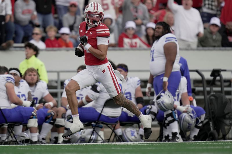 Wisconsin wide receiver Jayden Ballard (4) scores a touchdown on a 58-yard reception during the fourth quarter of the game Saturday, September 6, 2025 at Camp Randall Stadium in Madison, Wisconsin. Wisconsin beat Middle Tennessee 42-10.