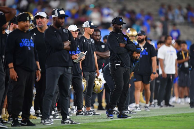 Aug 30, 2025; Pasadena, California, USA; UCLA Bruins head coach DeShaun Foster watches game action against the Utah Utes during the second half at Rose Bowl. Mandatory Credit: Gary A. Vasquez-Imagn Images