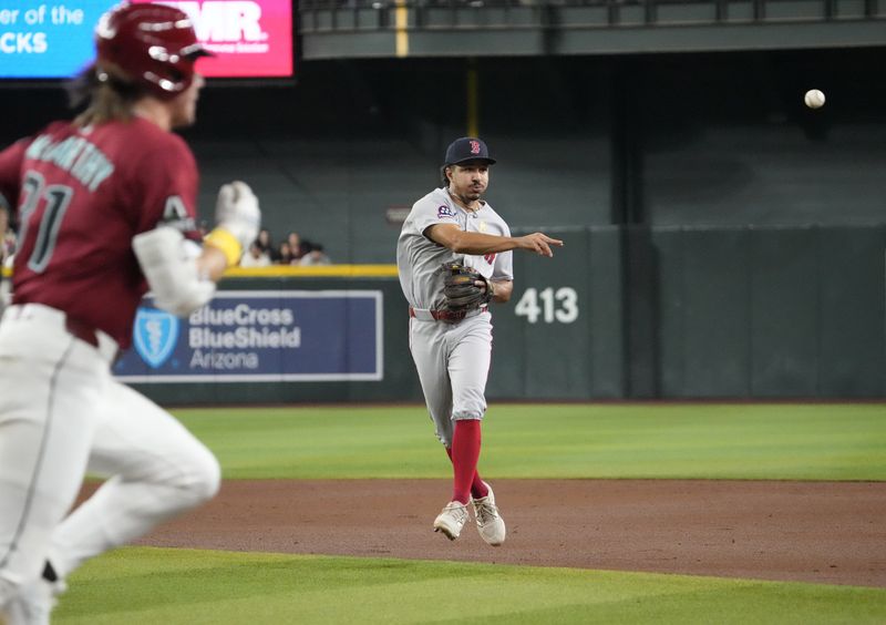 Boston Red Sox second baseman David Hamilton (17) throws out Arizona Diamondbacks' Jake McCarthy (31) during the second inning at Chase Field on Sept. 7, 2025.