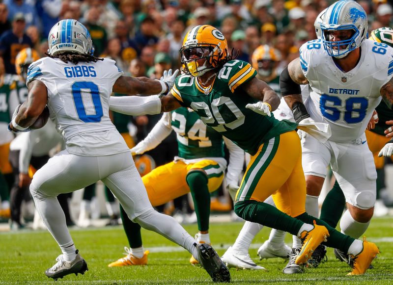 Green Bay Packers safety Javon Bullard pursues Detroit Lions running back Jahmyr Gibbs.