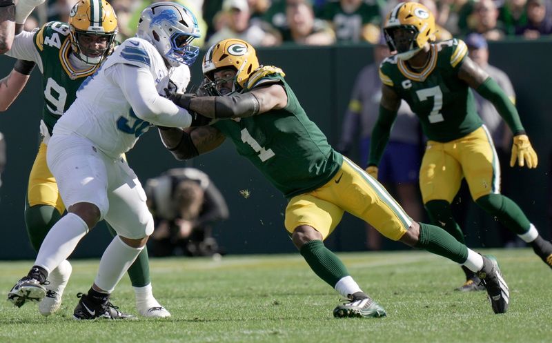 Detroit Lions offensive tackle Penei Sewell (58) blocks Green Bay Packers defensive end Micah Parsons (1) during the second quarter of their game Sunday, September 7, 2025 at Lambeau Field in Green Bay, Wisconsin.
