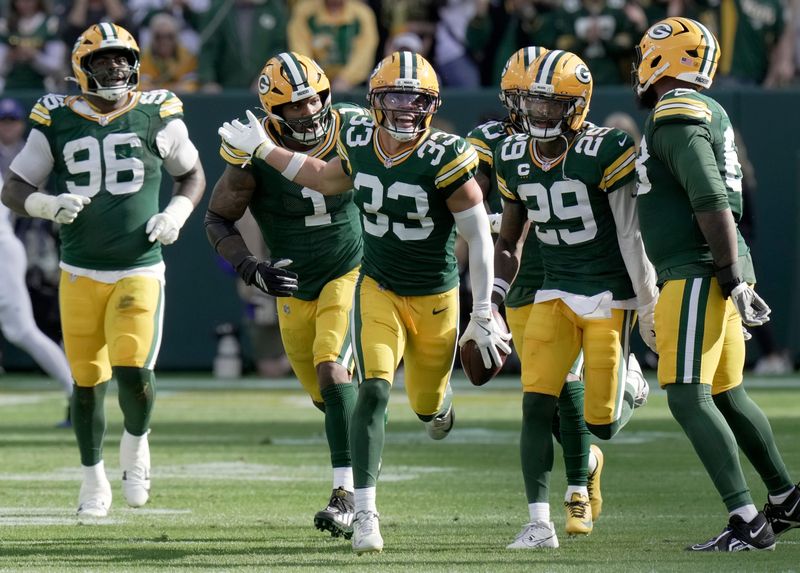 Green Bay Packers safety Evan Williams (33) celebrates his interception during the second quarter of their game against the Detroit Lions Sunday, September 7, 2025 at Lambeau Field in Green Bay, Wisconsin.