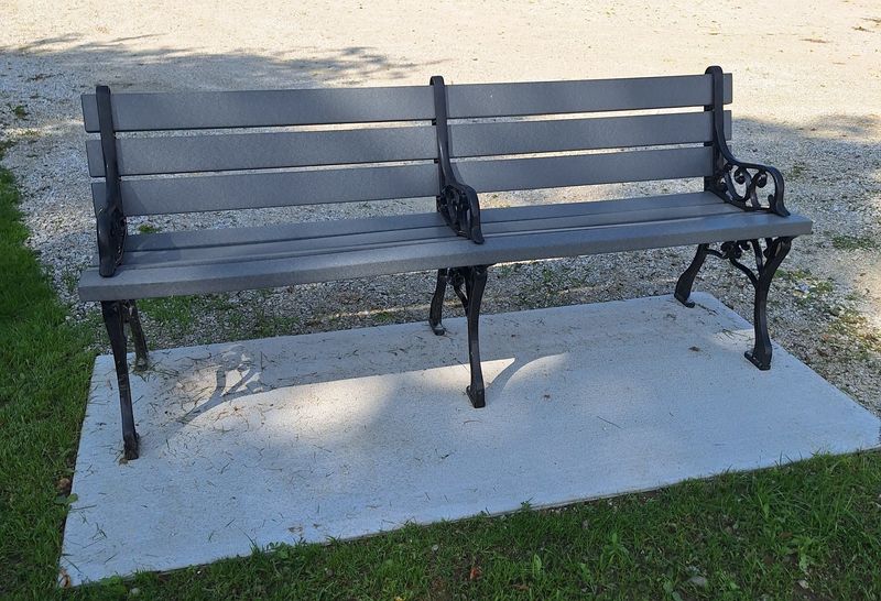 The weatherproof bench purchased by the three children of Jim and Cindy Carrell in their memory. It is situated at Tuma Lake, seats four people and gives visitors a view of most of the lake.