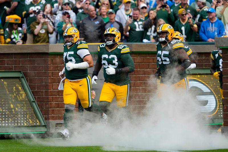 Sep 7, 2025; Green Bay, Wisconsin, USA; Green Bay Packers guard Sean Rhyan (75), offensive tackle Rasheed Walker (63) and guard Aaron Banks (65) prior to the game against the Detroit Lions at Lambeau Field. Mandatory Credit: Jeff Hanisch-Imagn Images