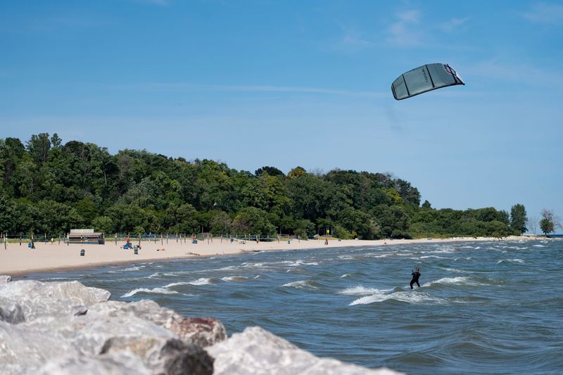 Kite surfers take advantage of a windy afternoon at Bradford Beach on Lake Michigan in Milwaukee, Wisconsin, on Sept. 10, 2025.