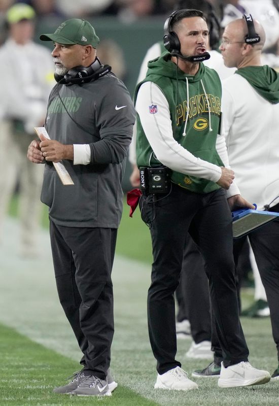 Green Bay Packers head coach Matt LaFleur, right, and assistant head coach/special teams coordinator Rich Bisaccia are shown after having to call a time out during the fourth quarter of their game Thursday, September 11, 2025 at Lambeau Field in Green Bay, Wisconsin. The Green Bay Packers beat the Washington Commanders 27-18
