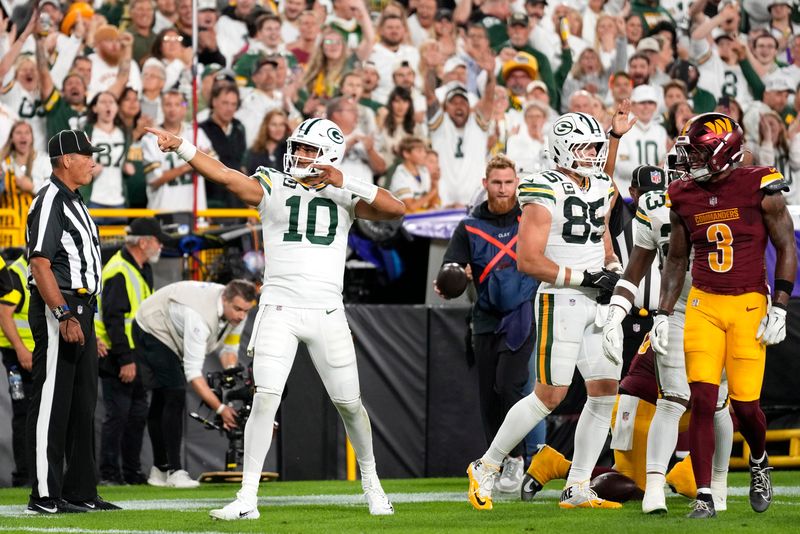 Sep 11, 2025; Green Bay, Wisconsin, USA; Green Bay Packers quarterback Jordan Love (10) reacts after a first down against the Washington Commanders in the first quarter at Lambeau Field. Mandatory Credit: Jeff Hanisch-Imagn Images