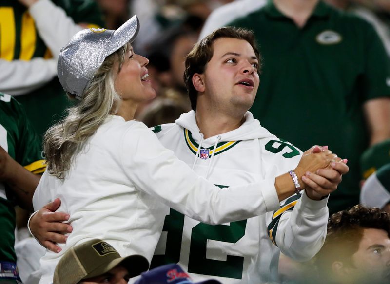 Green Bay Packers fans dance to "Roll out the Barrel" during a game against the Washington Commanders on Sept. 11, 2025, at Lambeau Field in Green Bay, Wis. The Packers defeated the Commanders 27-18.