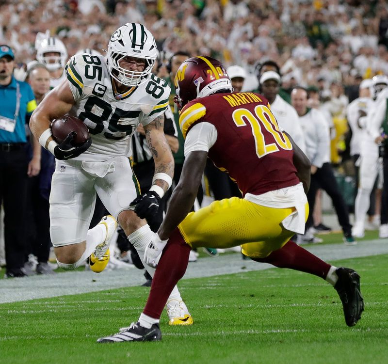 Green Bay Packers tight end Tucker Kraft (85) carries the ball during a game against the Washington Commanders on Sept. 11, 2025, at Lambeau Field in Green Bay, Wis. The Packers defeated the Commanders 27-18.