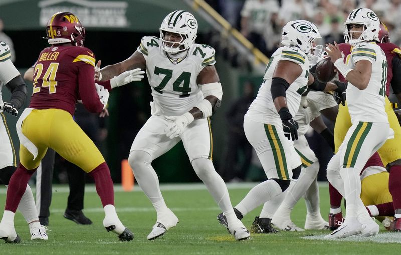 Green Bay Packers guard Elgton Jenkins (74) provide pass protection for quarterback Jordan Love (10) during the first quarter of their game against the Washington Commanders Thursday, September 11, 2025 at Lambeau Field in Green Bay, Wisconsin.