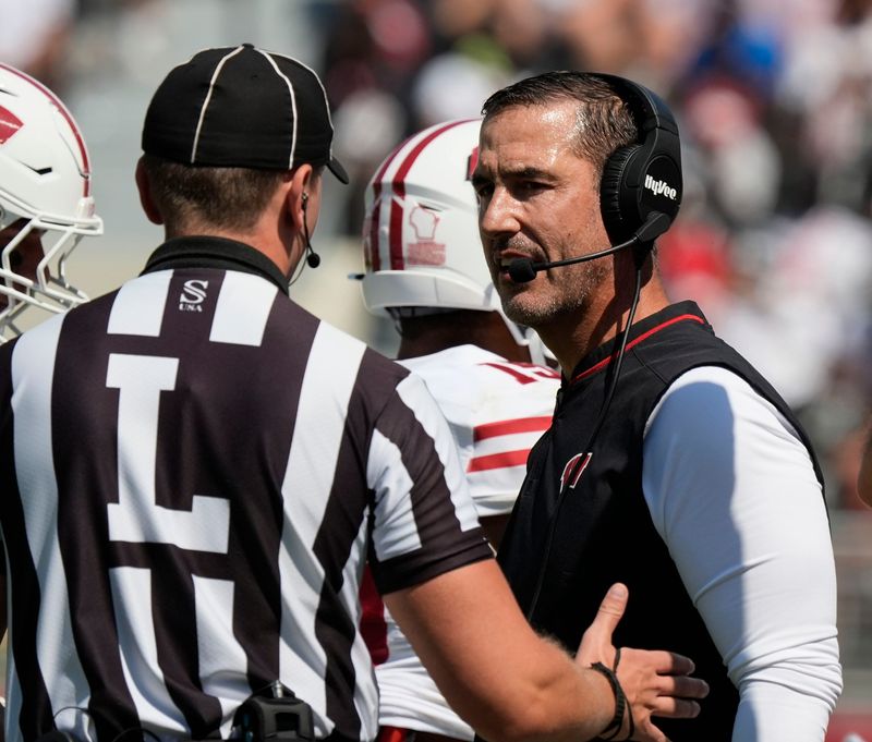 Sep 13, 2025; Tuscaloosa, Alabama, USA; Wisconsin head coach Luke Fickell questions an official during the game with Alabama at Saban Field at Bryant-Denny Stadium. Mandatory Credit: Gary Cosby-USA TODAY Network via Imagn Images