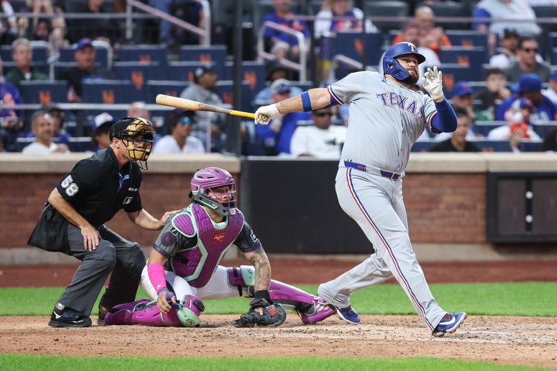 Sep 13, 2025; New York City, New York, USA; Texas Rangers pinch hitter Rowdy Tellez (44) hits an RBI double in the eighth inning against the New York Mets at Citi Field. Mandatory Credit: Wendell Cruz-Imagn Images