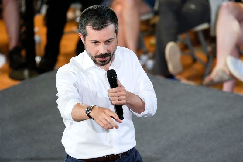 Former Transportation Secretary Pete Buttigieg calls on an audience member to ask a question during a town hall hosted by VoteVets on May 13, 2025 in Cedar Rapids, Iowa.