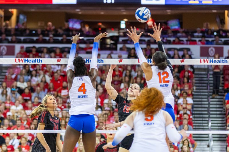 Florida's Jaela Auguste and Kira Hutson attempt to block Wisconsin's Mimi Colyer during the first set of the Kohl Center Classic in Madison on Sept. 21, 2025.