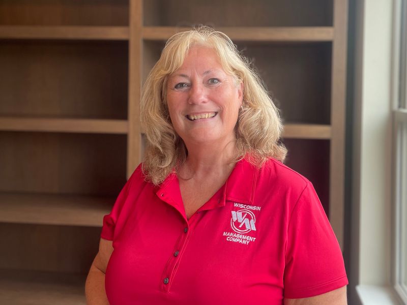 Elizabeth Sili, property manager for The Flats at Bishop's Woods, 350 Bishops Way, stands on the second floor of the new four-story, 203-unit affordable apartment building in Brookfield.