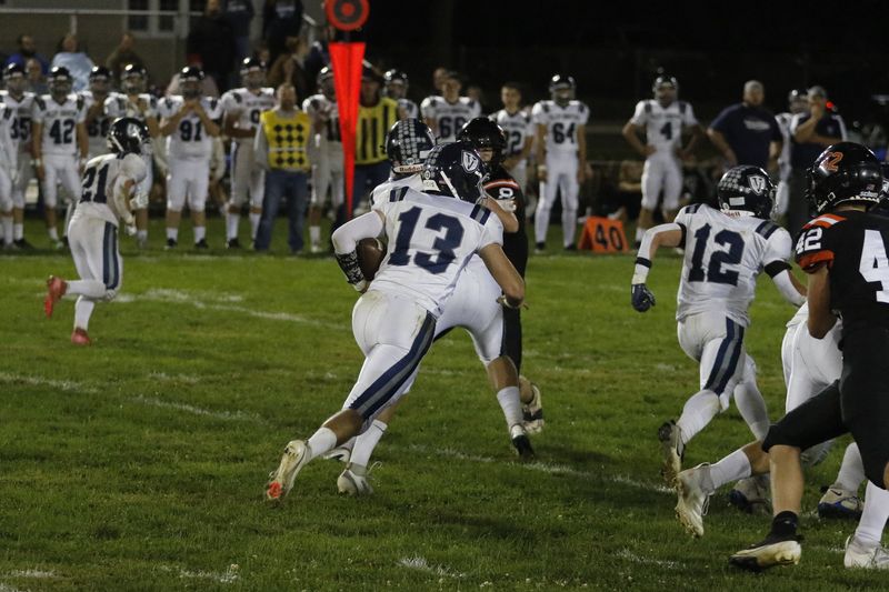 Valley Christian's Mason Everts on a rushing attempt against Oakfield at Oakfield Village Park in Week 6 on Friday, Sept. 26, 2025. Oakfield beat Valley Christian 48-0.