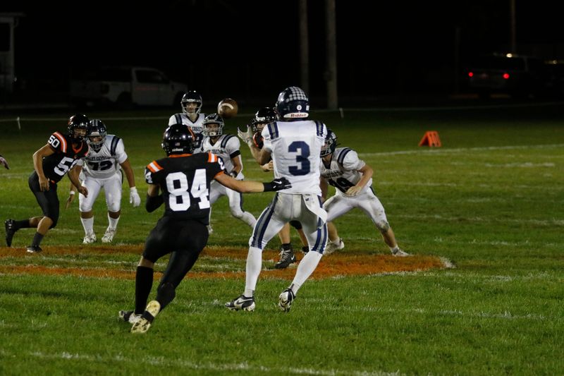 Valley Christian's Matthias Behling looks in a pass against Oakfield at Oakfield Village Park in Week 6 on Friday, Sept. 26, 2025. Oakfield beat Valley Christian 48-0.