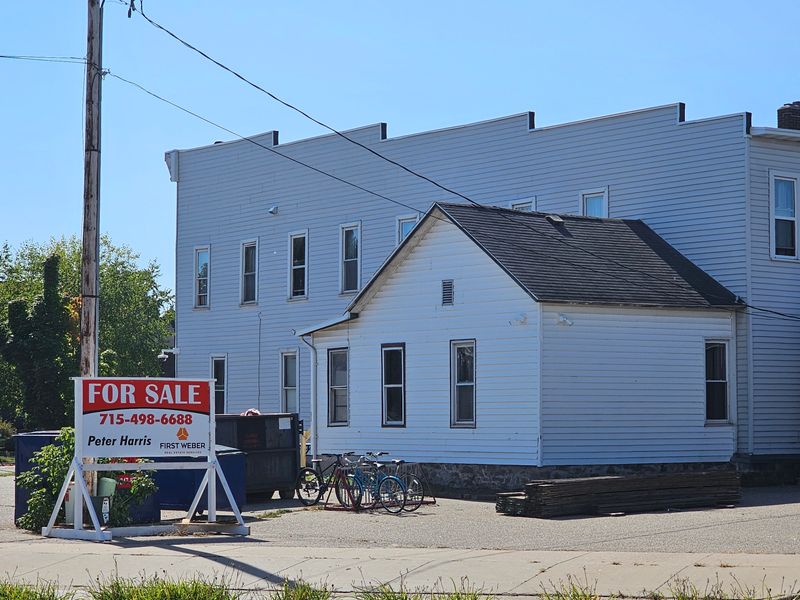 A "For Sale" sign sits along Church Street on the east side of the Monroe House, located at 1700 Monroe St. in Stevens Point, Wisconsin, on Sept. 29, 2025