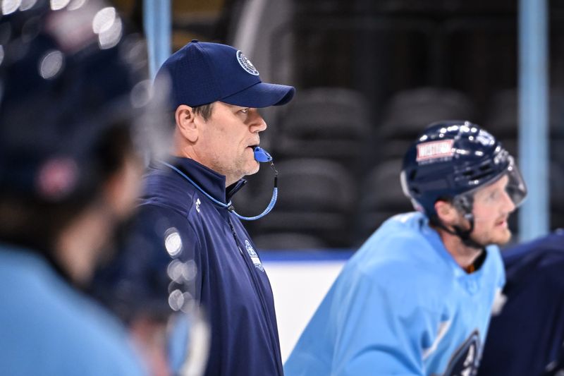 Milwaukee Admirals head coach Karl Taylor supervises drills on the opening day of training camp on Tuesday, Sept. 30 at the UWM Panther Arena.
