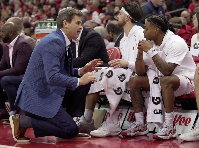 Wisconsin special assistant to the head coach Kirk Penney speaks with guard Kamari McGee during the first half of their game Tuesday, February 18, 2025 at the Kohl Center in Madison, Wisconsin.