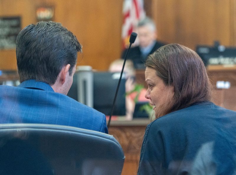 Amandria Brunner, right, speaks to her attorney Dustan Davidson, left, during a preliminary hearing before Judge David Borowski for a preliminary hearing on Thursday October 2, 2025 at the Milwaukee County Safety Building in Milwaukee, Wisconsin. Brunner faces two counts of homicide by intoxicated use of a vehicle in the Sept. 5 crash that killed two Marquette University lacrosse players.