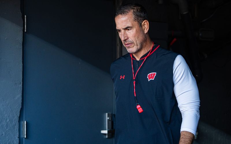 Wisconsin head coach Luke Fickell enters the field before a game against Wisconsin at Michigan Stadium in Ann Arbor on Saturday, Oct. 4, 2025.