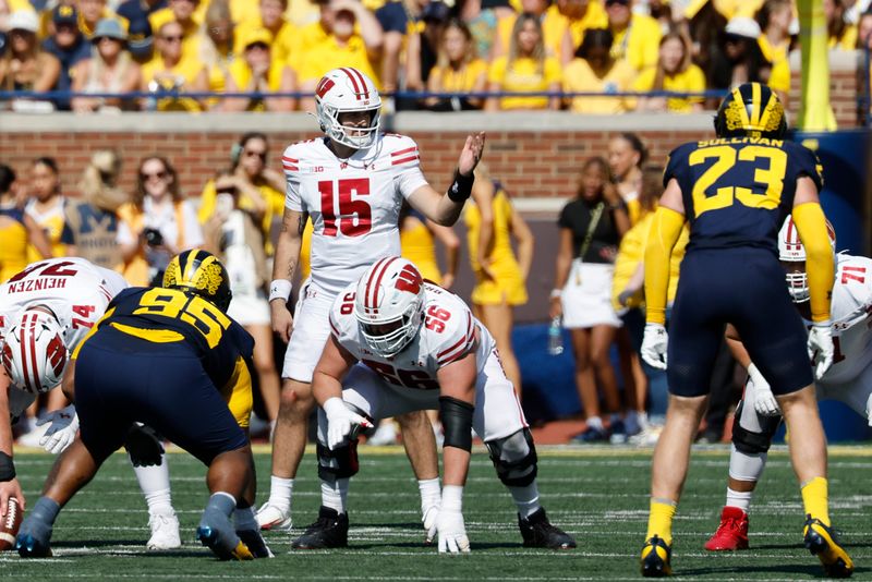 Badgers quarterback Hunter Simmons  gets set to run a play in the first half against Michigan at Michigan Stadium on Saturday, Oct. 4.