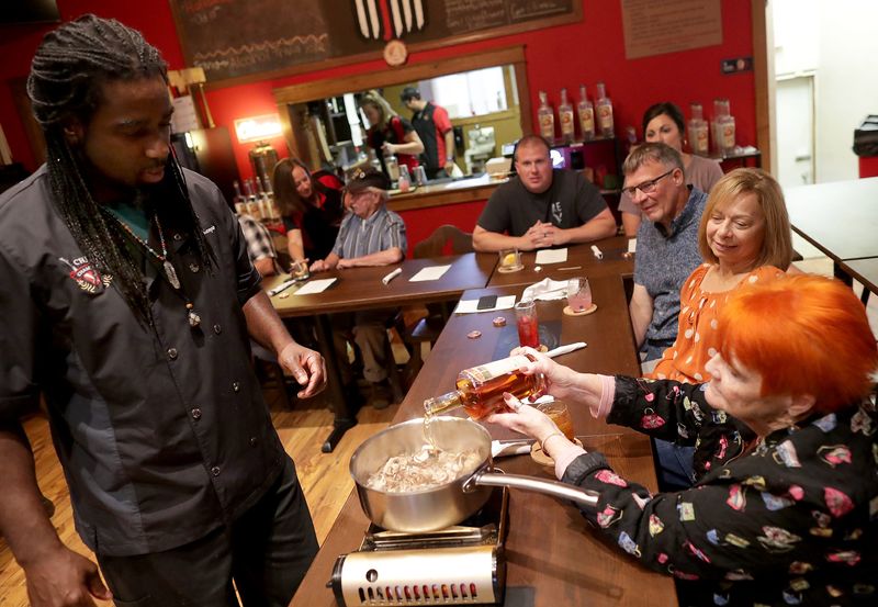 Jennifer Leitzke, celebrating her birthday, pours bourbon into a sauce with Chef Ace Champion during a cooking demonstration at Old Station 31 Spirits on Tuesday September 30, 2025, in Dale, Wisconsin.
Wm. Glasheen USA TODAY NETWORK-Wisconsin