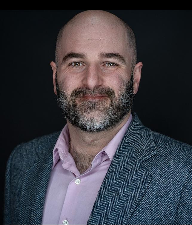 Former Oshkosh Community Players president Justin Drabek is being accused of draining the theater group's bank accounts.