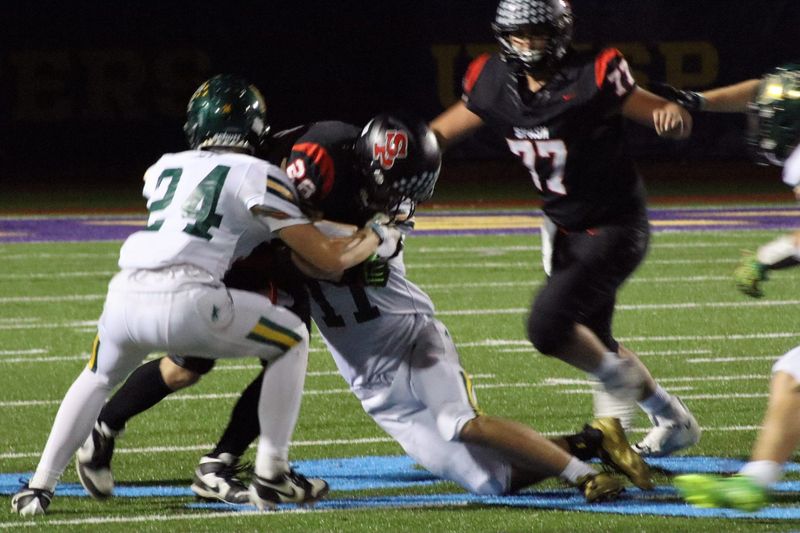 SPASH senior Tucker Phillips is tackled at Georke Field in Stevens Point on Friday, Oct 10, 2025. D.C. Everest beat SPASH 28-13 (Alfred Smith/ Wausau Daily Herald).