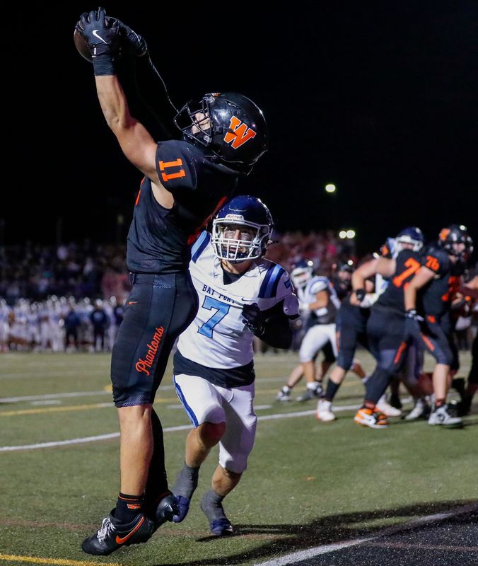 West De Pere's Braylon Stegall (11) catches a go-ahead touchdown pass against Bay Port on Oct. 10 at West De Pere High School.