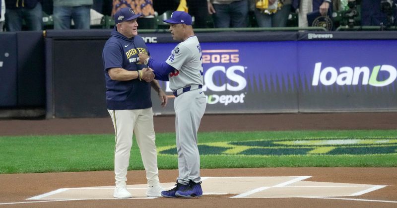 Milwaukee Brewers manager Pat Murphy (49) and Los Angeles Dodgers manager Dave Roberts (30) are shown before their National League Championship Series game October 13, 2025 at American Family Field in Milwaukee, Wisconsin.