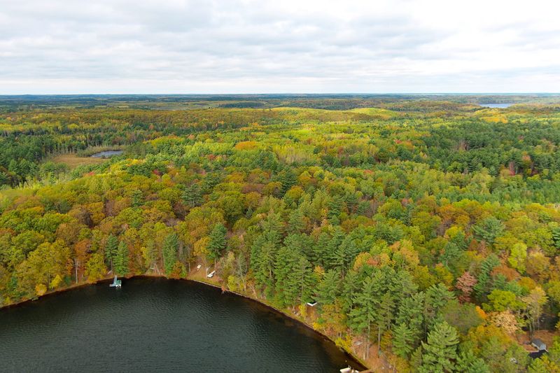 A drone provides a view of fall colors around Lower Kaubashine Lake in Hazelhurst, Wisconsin, on Oct. 12, 2025.