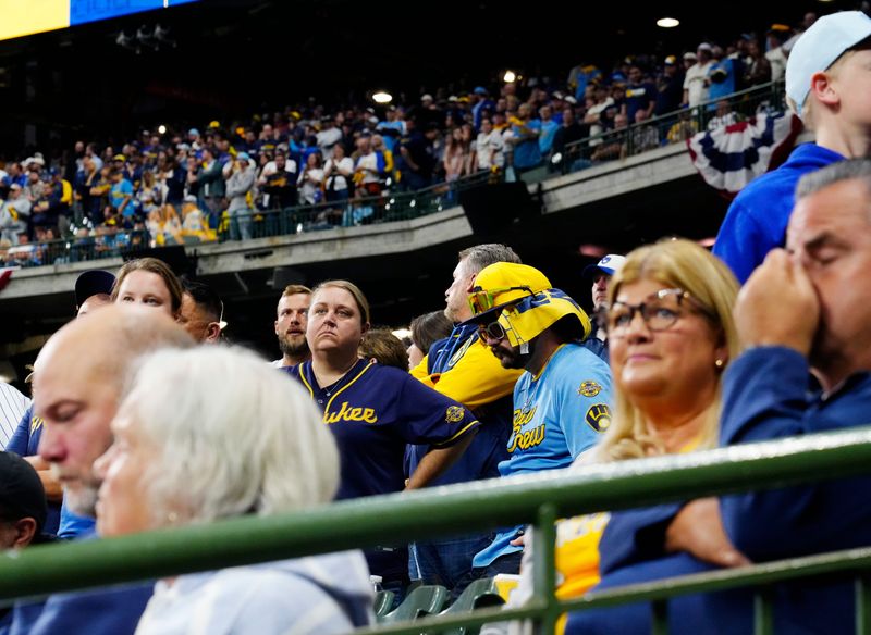 Milwaukee Brewers fans react during the ninth inning of the National League Championship Series game against the Los Angeles Dodgers October 14, 2025 at American Family Field in Milwaukee, Wisconsin.
