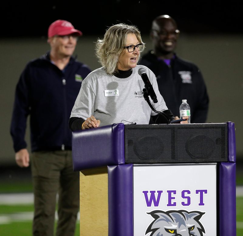 Green Bay School District Superintendent Vicki Bayer speaks during a rededication ceremony of Green Bay West High School's Del Marcelle Stadium before the 120 rivalry game against Green Bay East on Oct. 17. She plans to retire at the end of the school year.